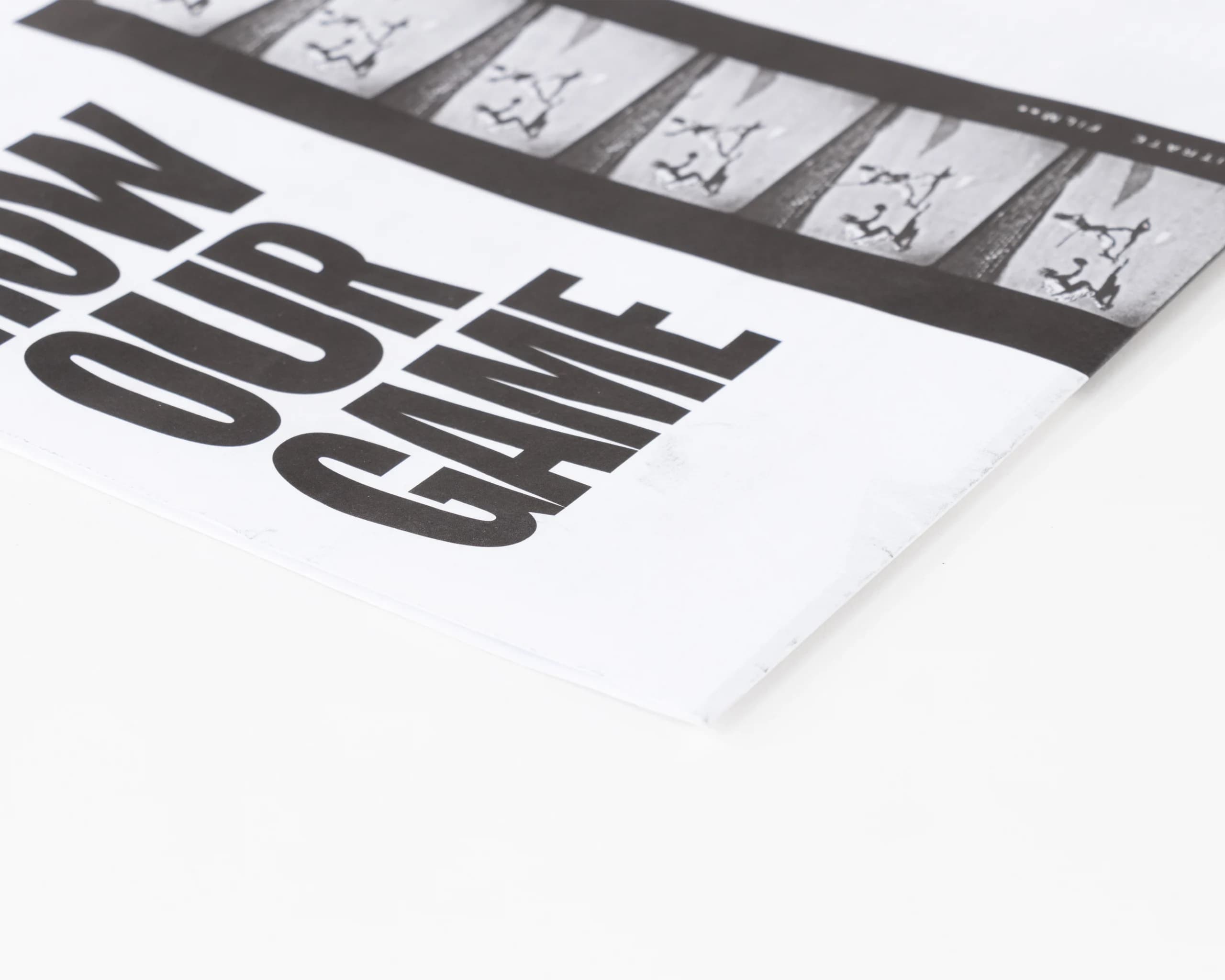 Close-up of black-and-white printed cover on uncoated newsprint