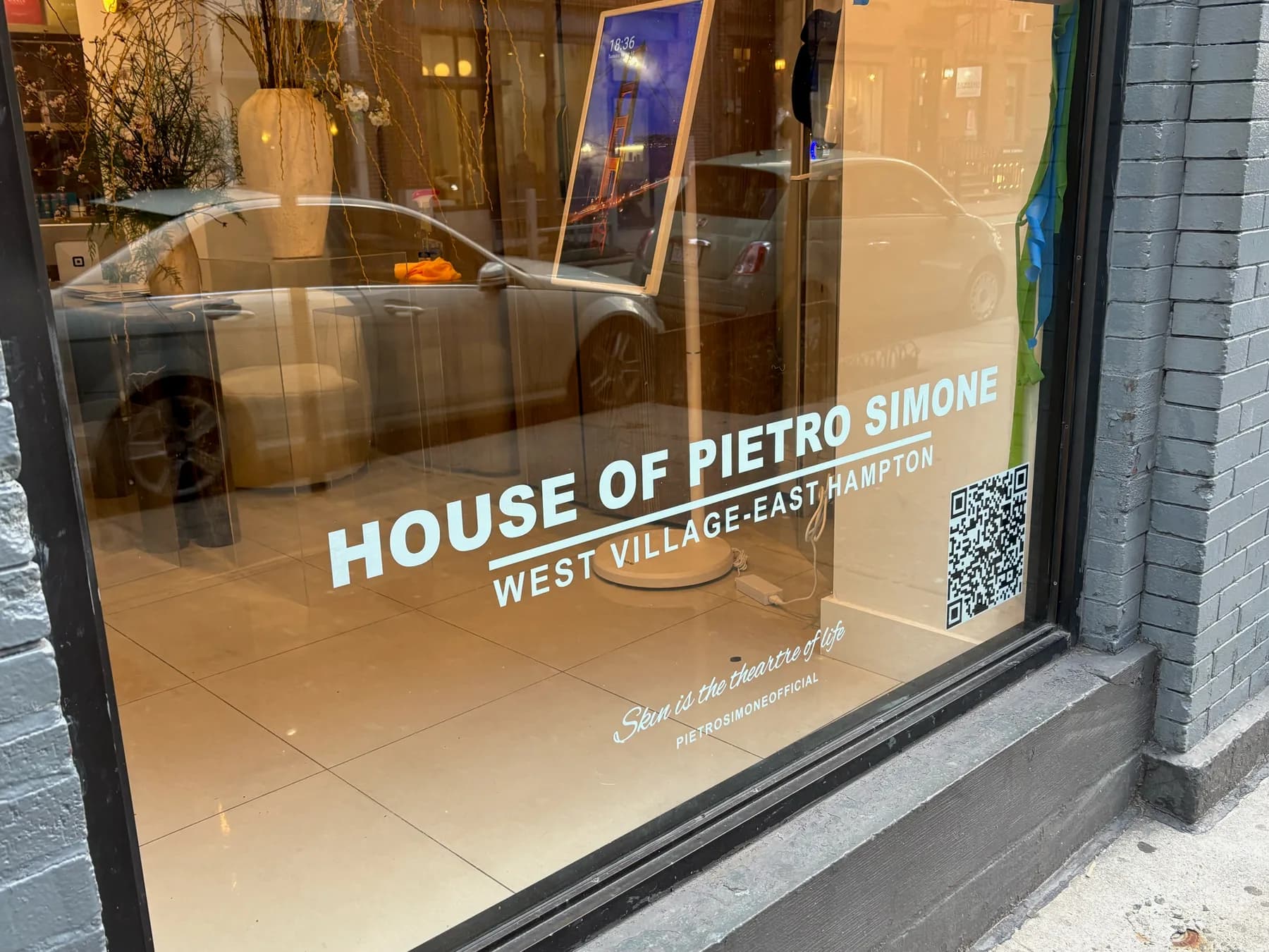 Printed window graphics installed across a storefront