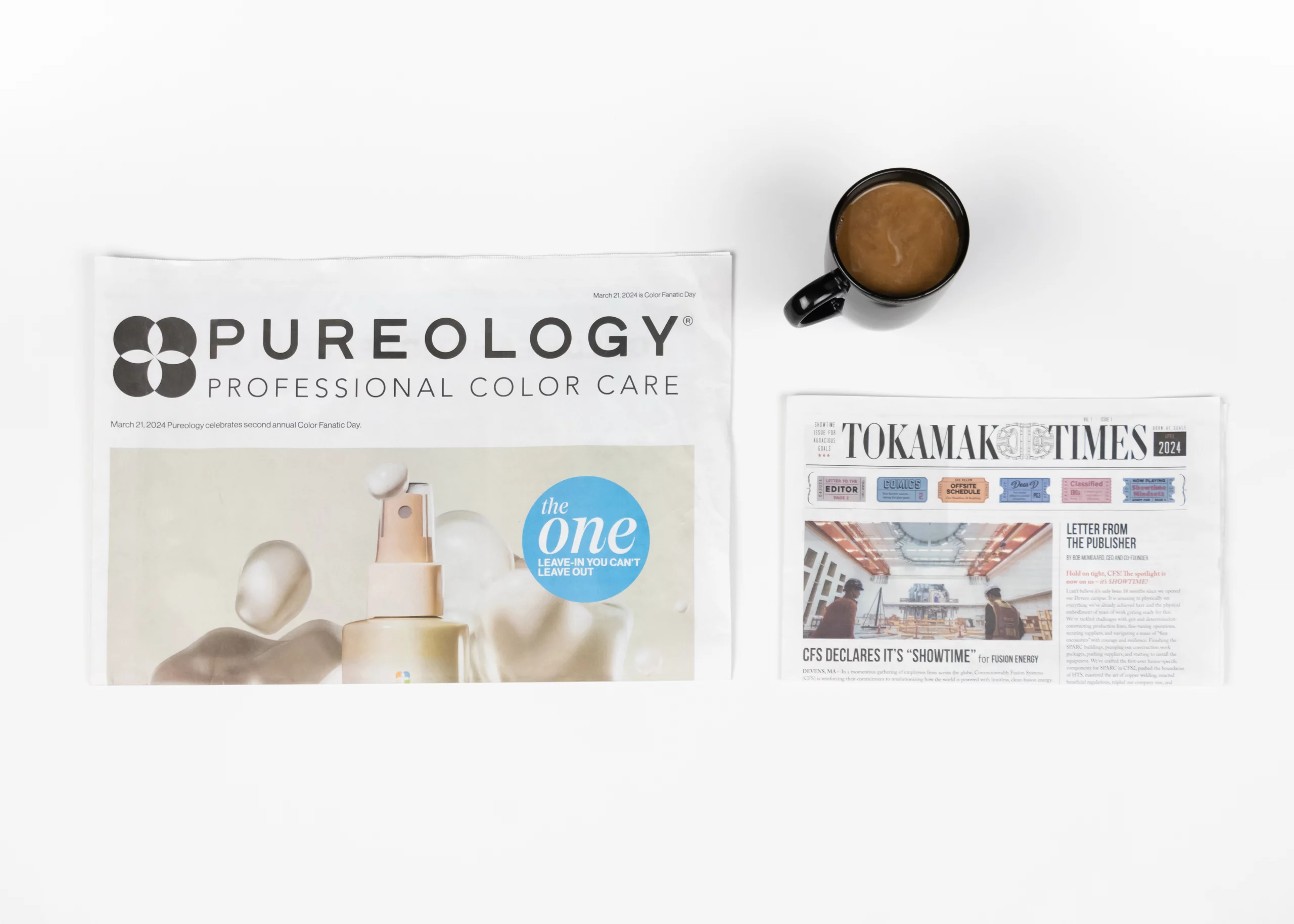 A folded broadsheet newspaper laying next to a folded tabloid newspaper showing their size differences.