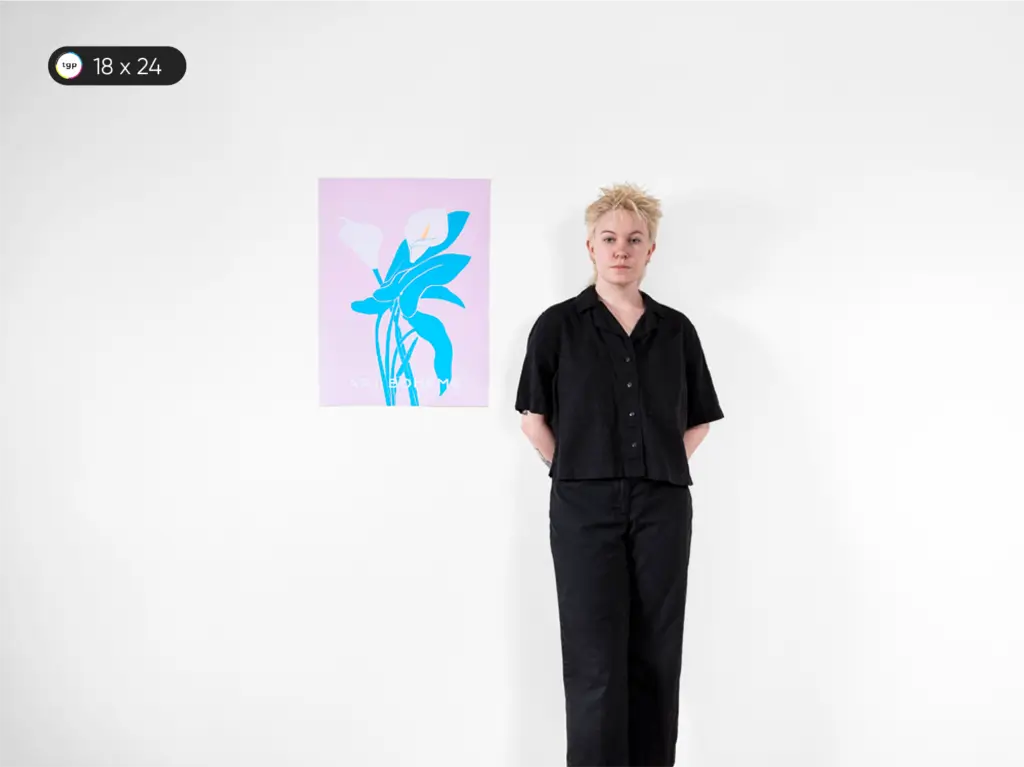In this image, a model is displaying an 18 x 24 inches or B2 size poster, referred to as Medium Poster. This poster size is akin to a small poster commonly seen in home decor.