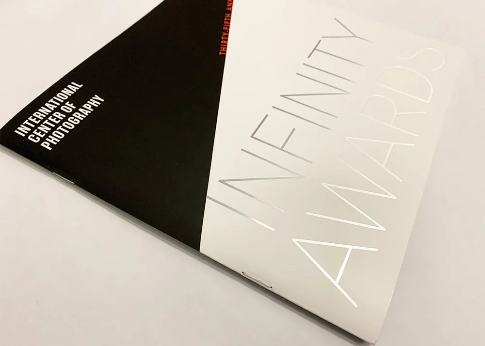 A saddle stitched booklet finished with foil printing. Printed for the International Center of Photography