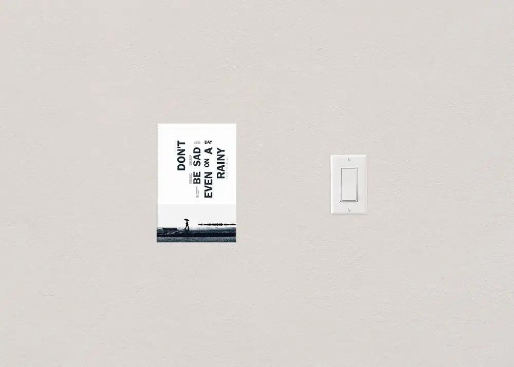 The 6x9 flyer size photographed next to a standard light switch to show scale.