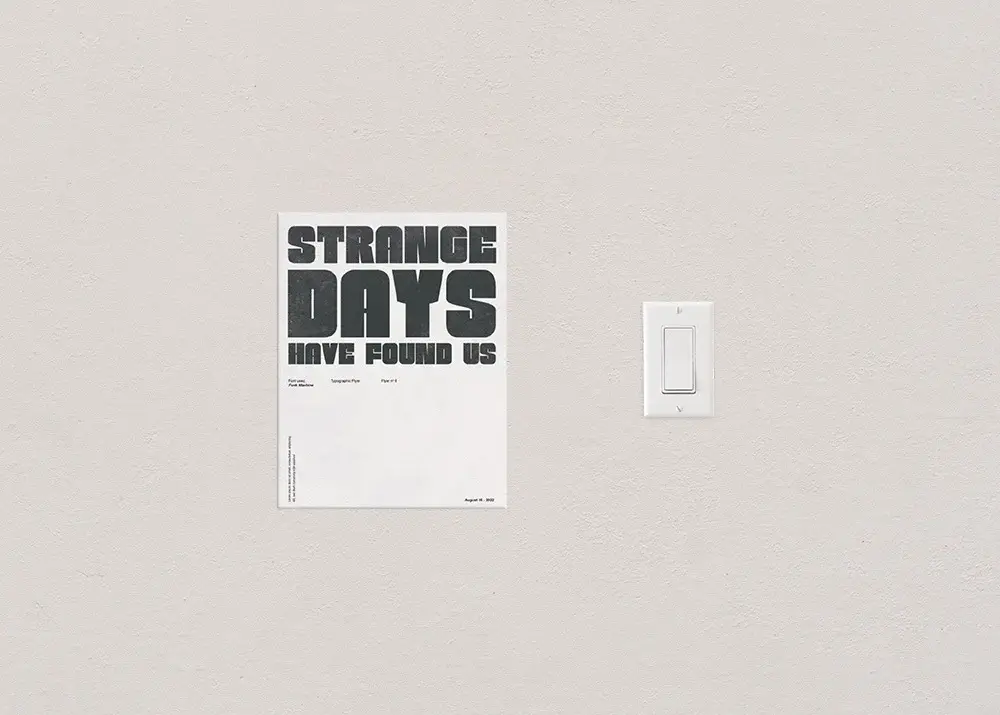 The 8.5 x 11 inch flyer size photographed next to a standard light switch to show scale.
