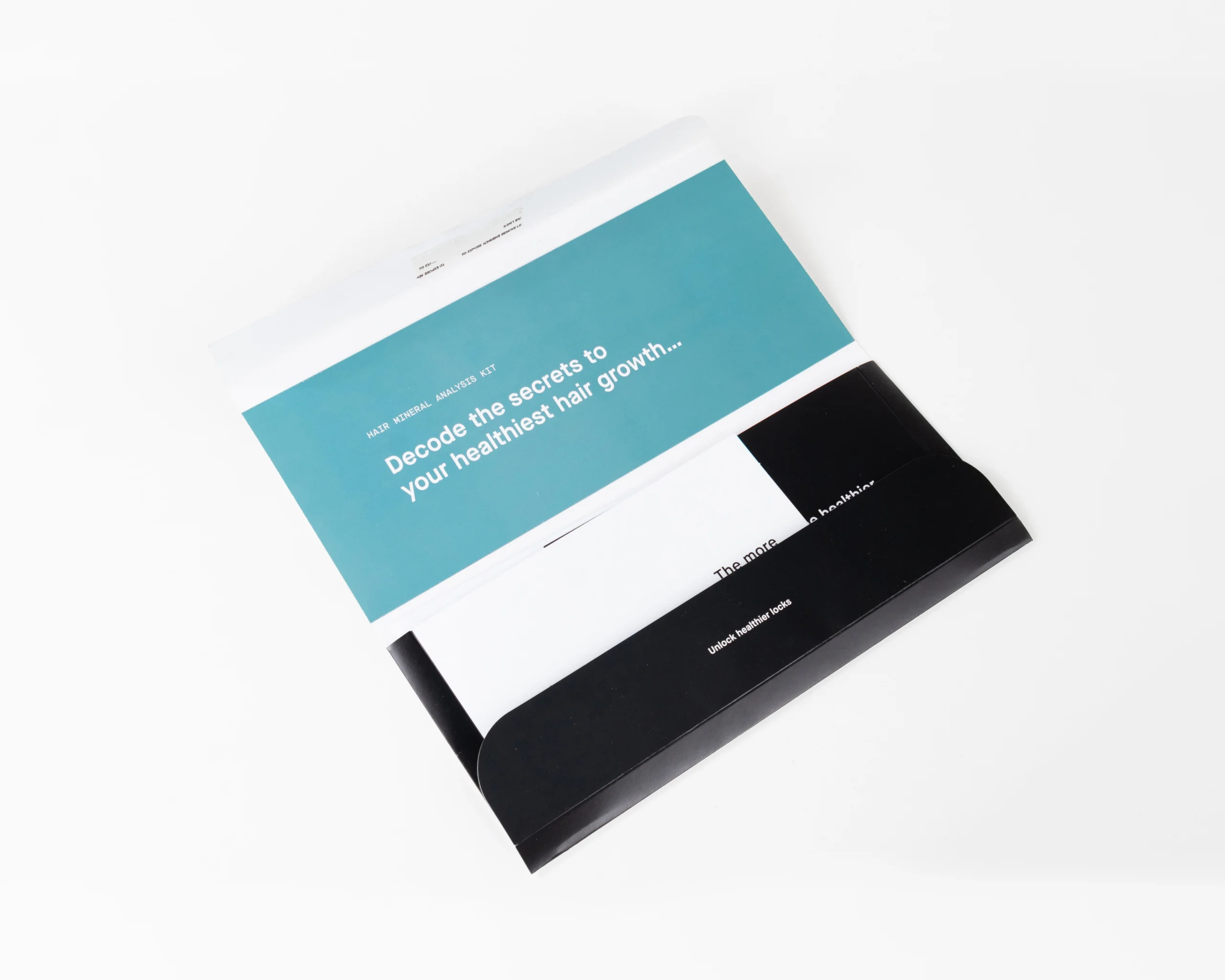 A custom cardboard mailer box for Nutrafol on a white background.